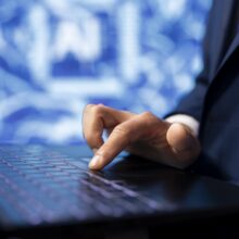 IT specialist coding on laptop, programming artificial intelligence, close up IT specialist coding on laptop, programming artificial intelligence, close up