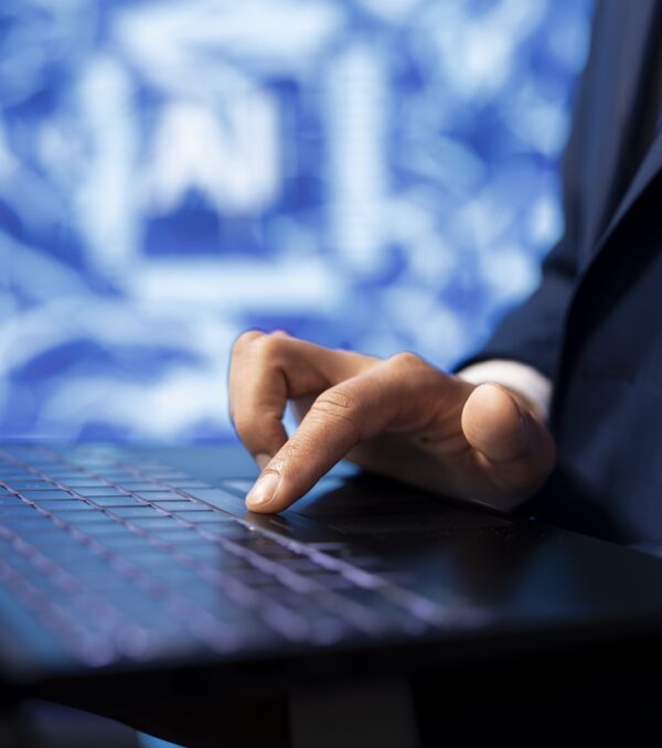 IT specialist coding on laptop, programming artificial intelligence, close up IT specialist coding on laptop, programming artificial intelligence, close up